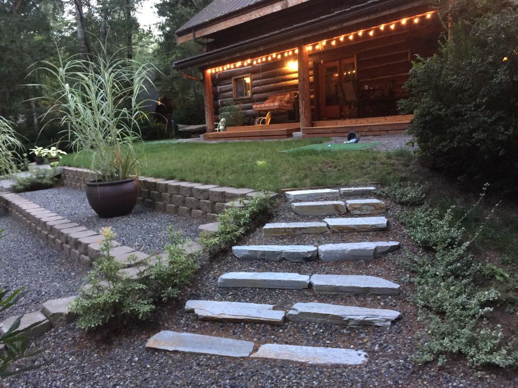 Refreshed landscaping and stone paver path at dusk