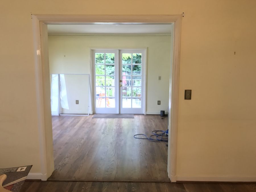 Refinished hardwood floors and french doors in a photo-ready interior